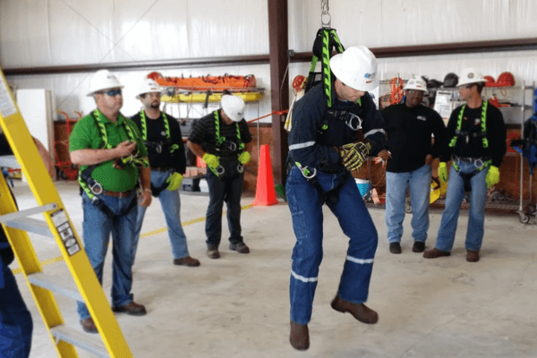 Industrial Safety Solutions worker hanging from a harness