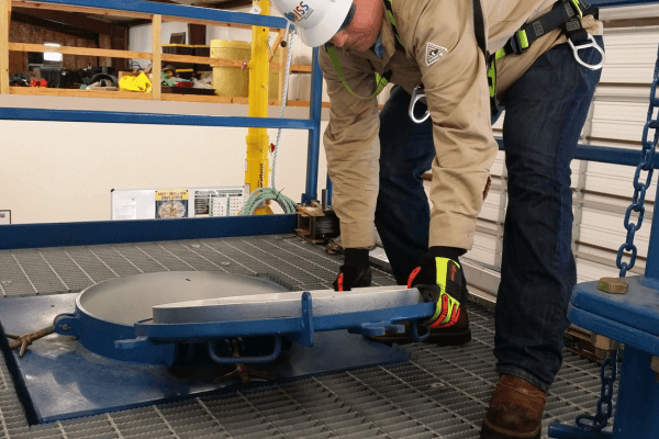 An Industrial Safety Solutions worker preparing to enter into a confined space 